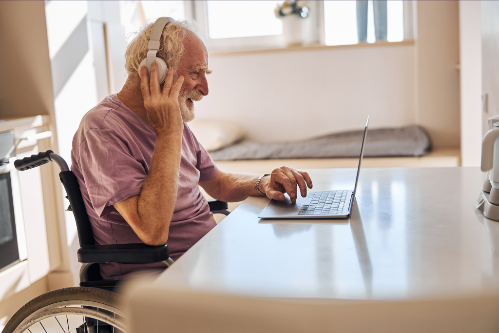 elder disabled man headphones computer
